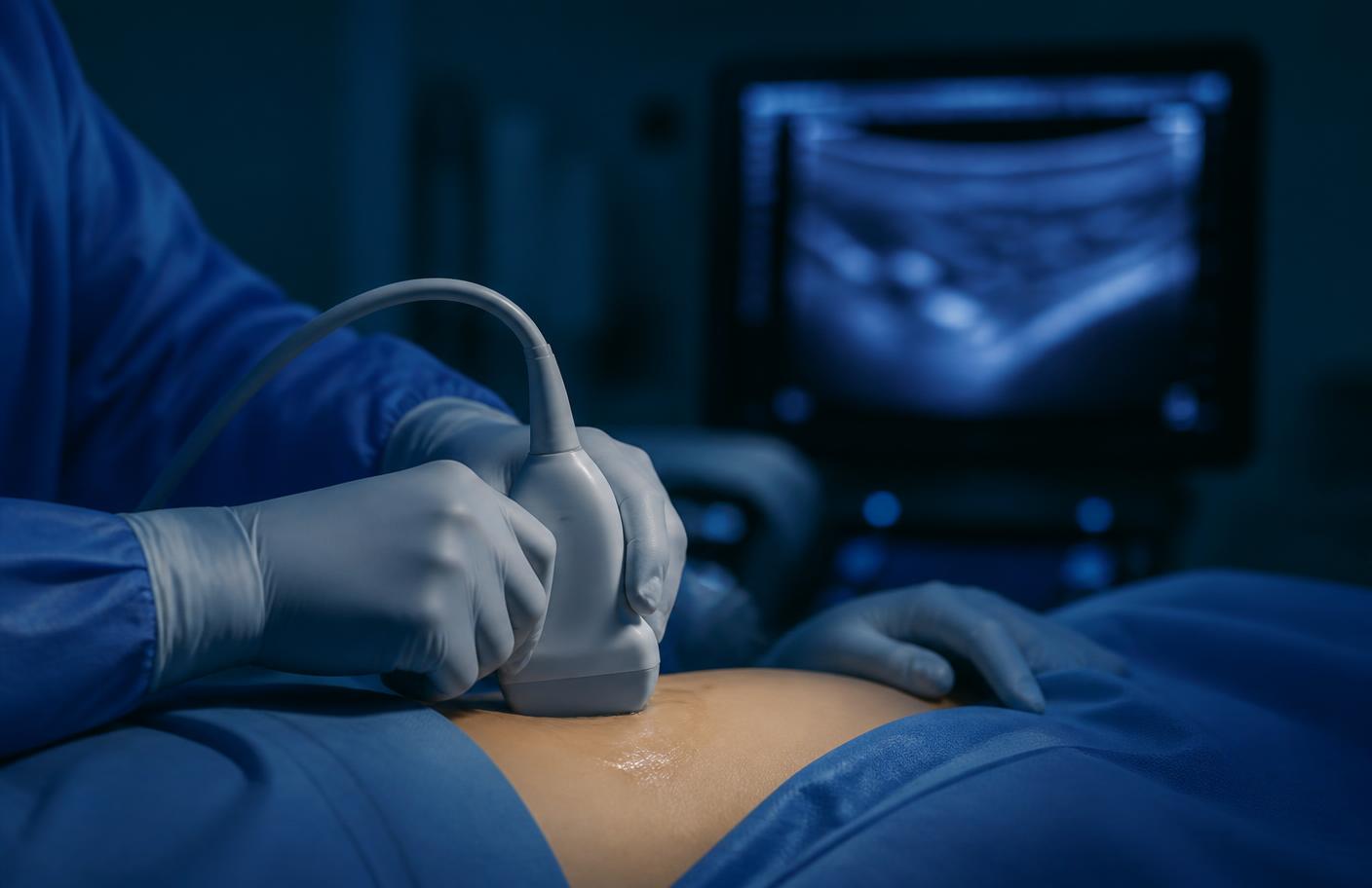 Gloved hands guiding an ultrasound probe during an image-guided pain procedure